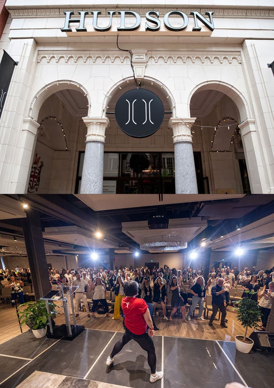 The image is composed of two photographs. The top photo displays the entrance of a building with a sign reading "HUDSON" above grand archways, indicative of an elegant and possibly historic venue. Below, the second photo captures an indoor event in progress with a lively atmosphere. A crowd of people is gathered around a stage where a person in a red shirt appears to be leading an activity or speaking, with the audience's attention directed towards them. The room suggests a formal event space, with attendees engaged in the proceedings.