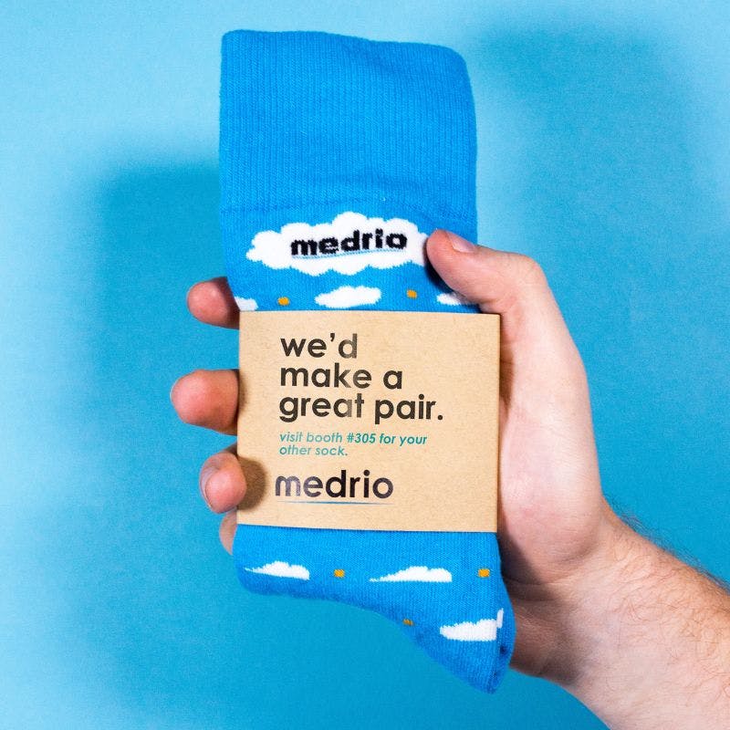 Custom sock that the company Medrio used as a trade show giveaway with their booth number on the packaging