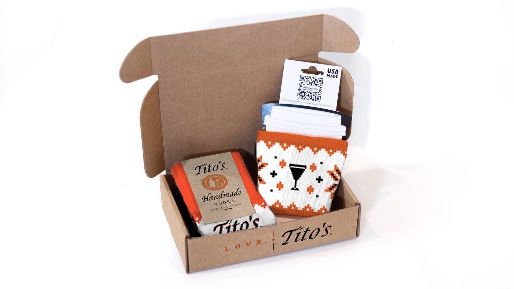 Holiday Knit Kit featuring our custom socks, custom gift box, and custom woven beverage holder
