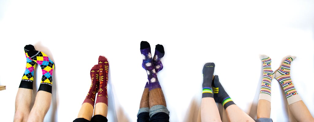 custom socks with logo on people's feet upside down