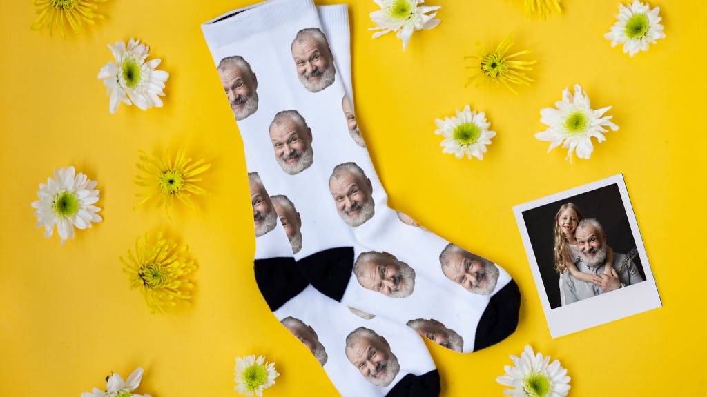 dad face socks on yellow background with flowers