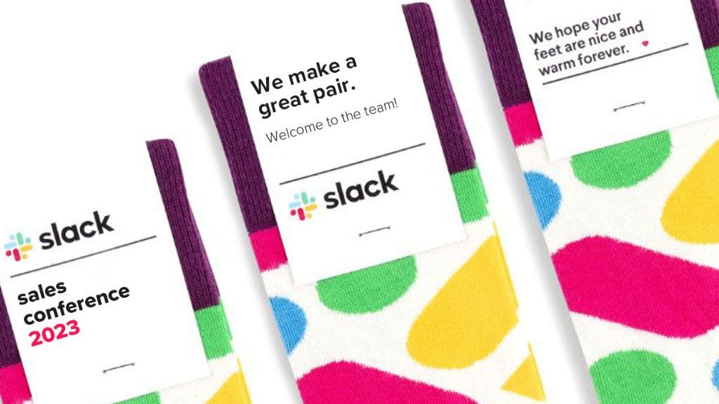 Three branded socks for Slack with different messaging on the custom sock header cards, including "we make a great pair" and "we hope your feet are nice and warm forever."