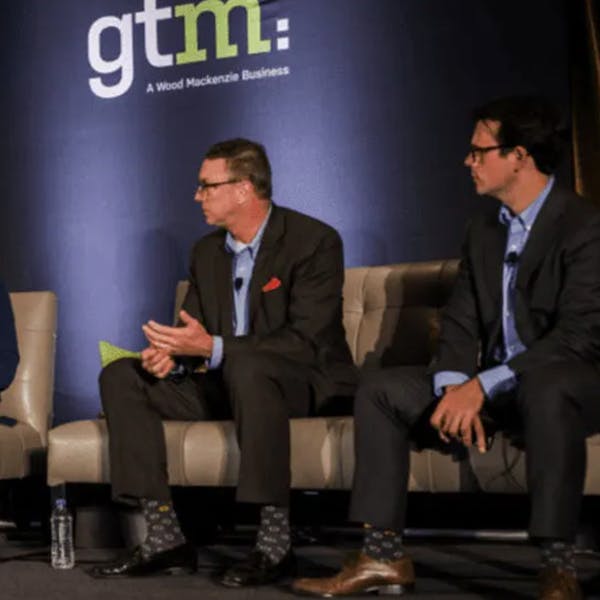 Folsom Lab executives wearing custom socks from Sock Club at speaking event