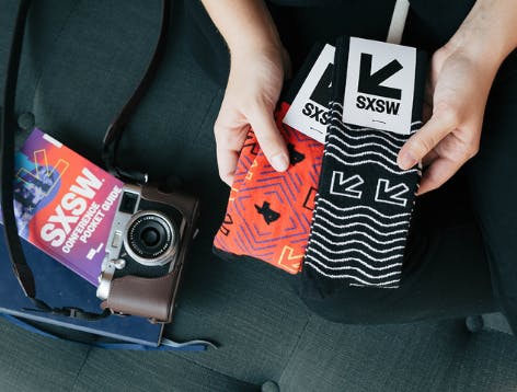 Red and black custom socks from the SXSW merch line