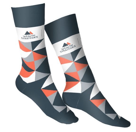 Custom socks with the Wealth Strategies logo and a navy, orange, grey, and white argyle pattern