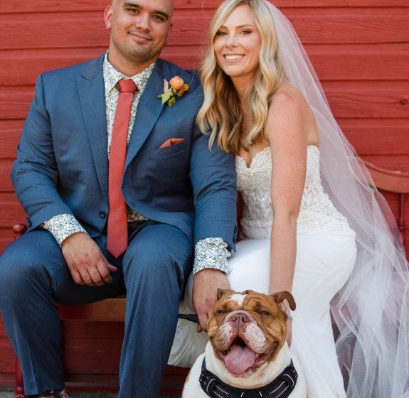 Blakeley and Brett on their wedding day with their dog, Brock