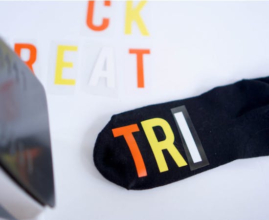 custom logo on socks via heat transfer on black sock