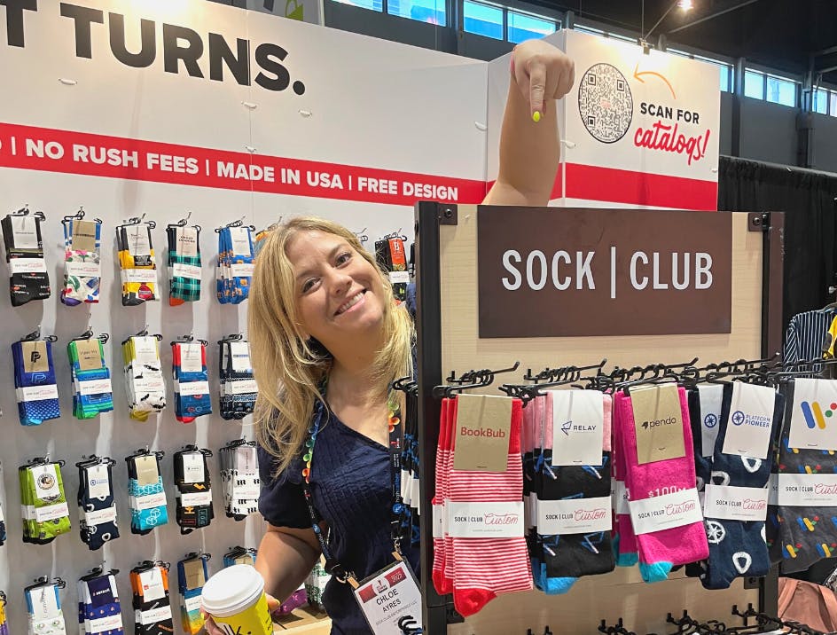 Chloe Ayres at Sock Club trade show booth at ASI Chicago 2022