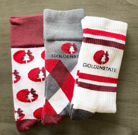 Golden State Lumber red, white, and grey custom logo socks with trees