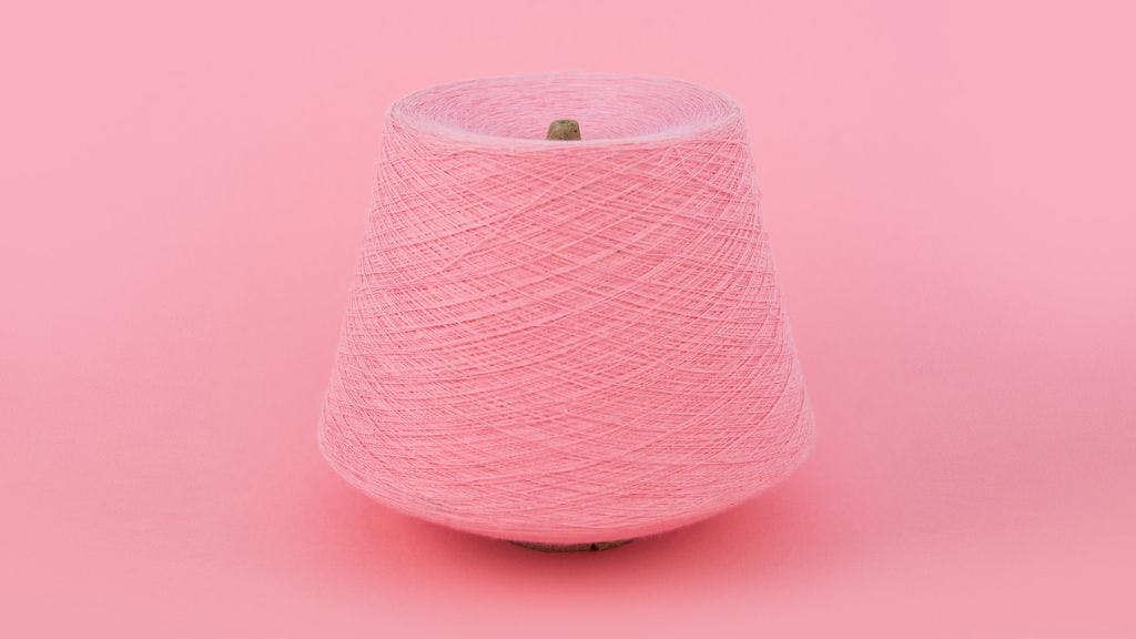 Pink skein of cotton yarn from Sock Club's custom sock colors