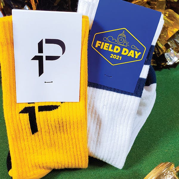 yellow and white custom soccer socks with custom sock packaging