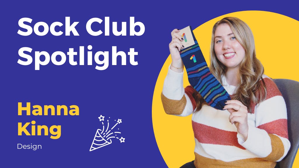 Woman smiling holding custom branded Google socks