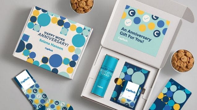 Branded kit for an employee anniversary featuring custom socks from Sock Club and sweet treats from Sofia's Cookies