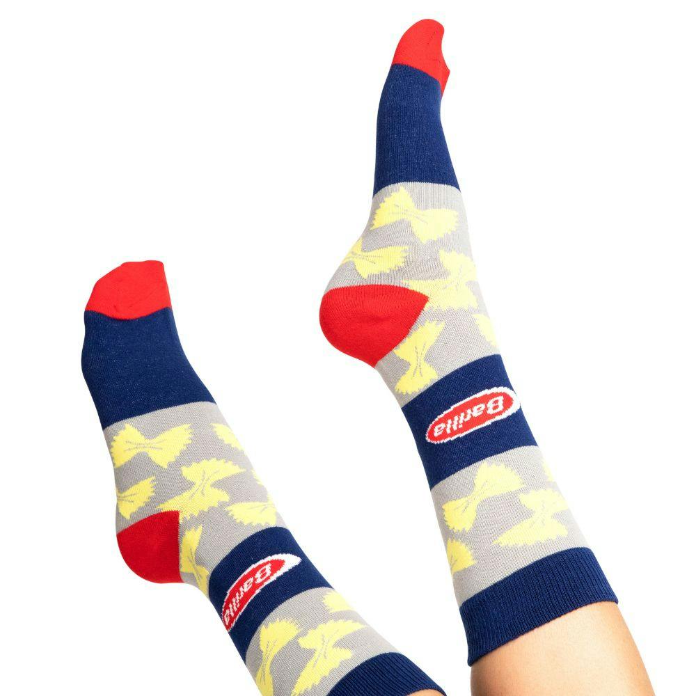 Model wearing Cheap Custom Socks that have been customized with the Barilla logo