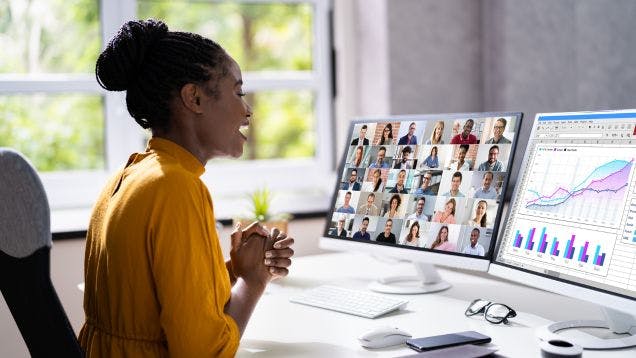 Event Marketing Manager hosting a virtual webinar in her modern office