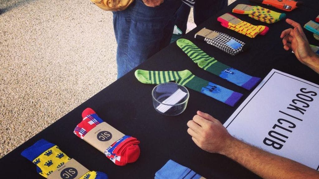 An early Sock Club booth to sell socks at a Farmer's Market