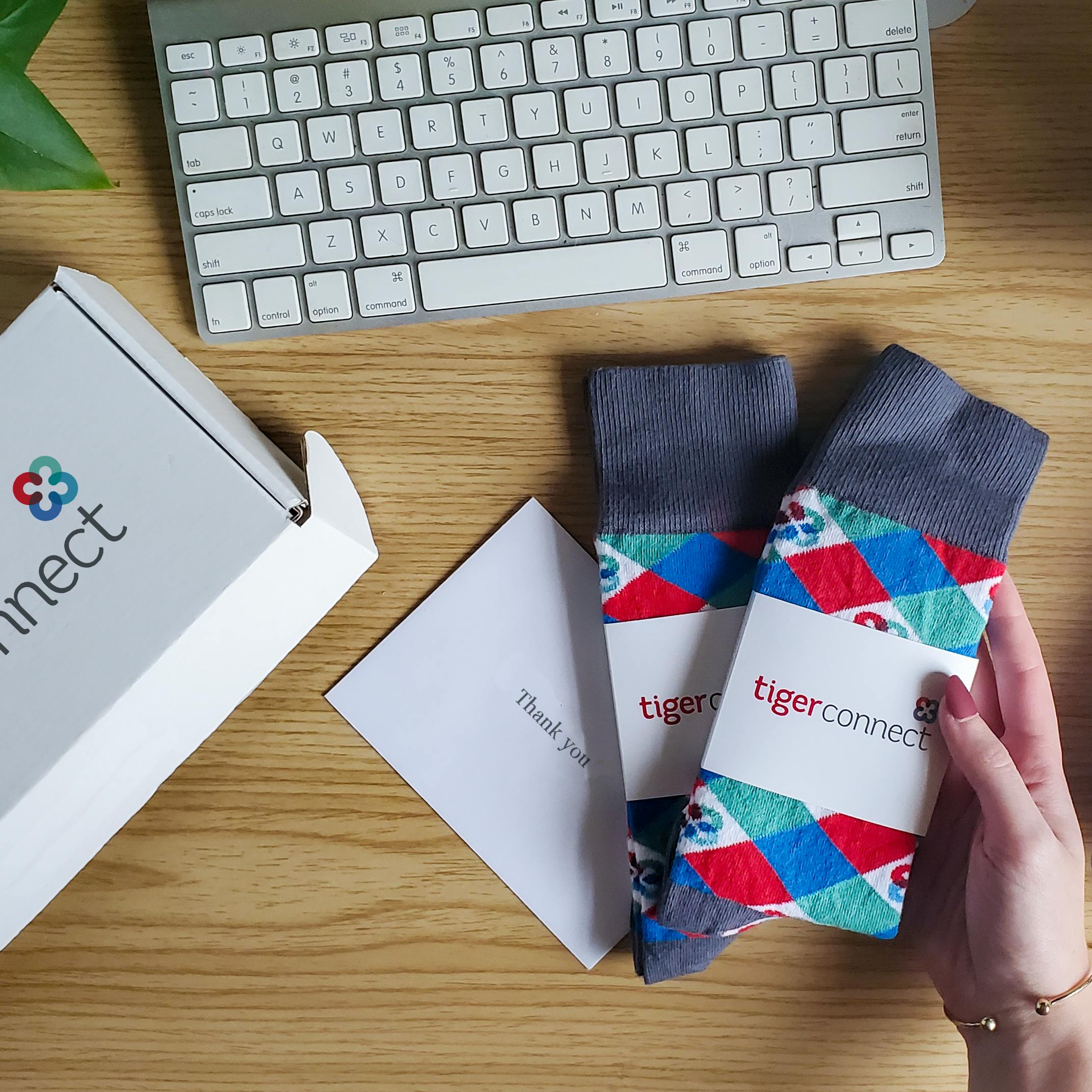 Person holding argyle socks received for virtual event