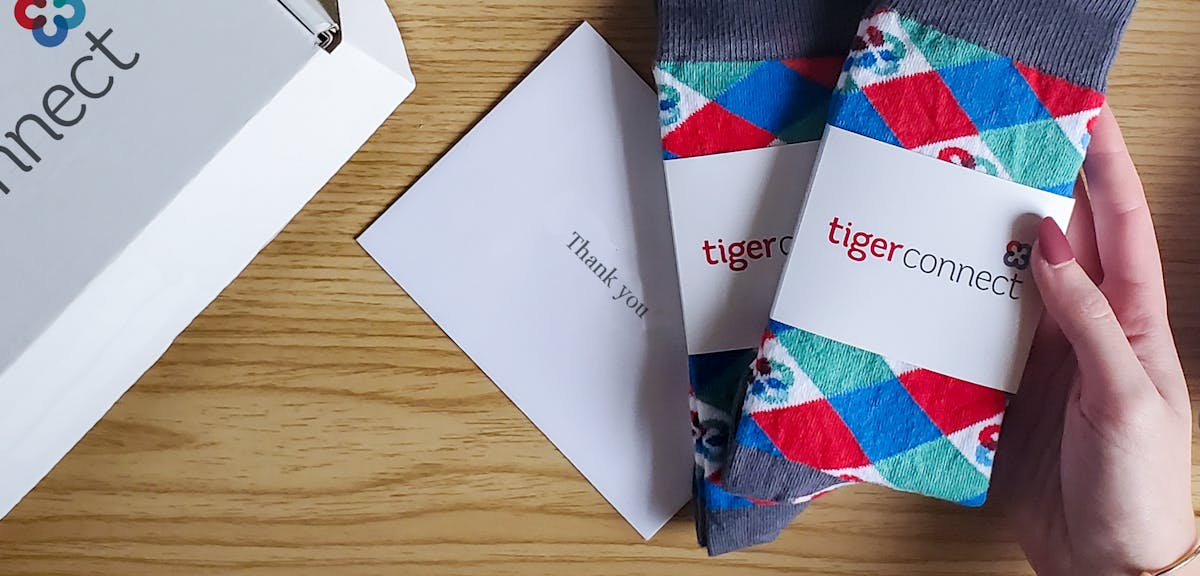 Person holding argyle socks received for virtual event