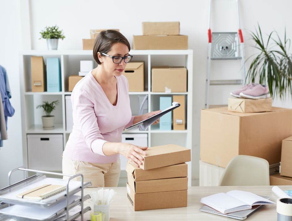 Woman in a clean, modern office managing complicated orders from a company store