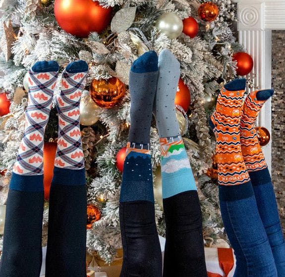 The line of custom socks that Sock Club designed for branded merchandise for the 2022 holiday season at Whatastore.