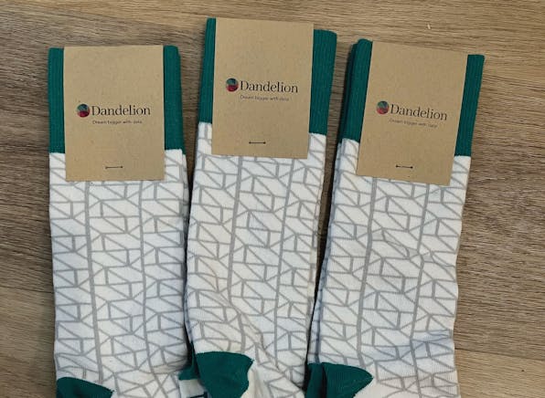 Dandelion Inc white and green custom socks with geometric pattern for client holiday gifts