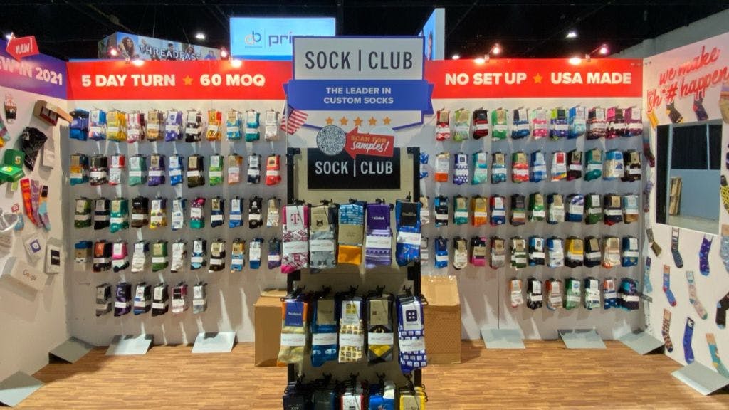 The Sock Club trade show booth featuring hundreds of pairs of custom socks showcasing our past work and booth design