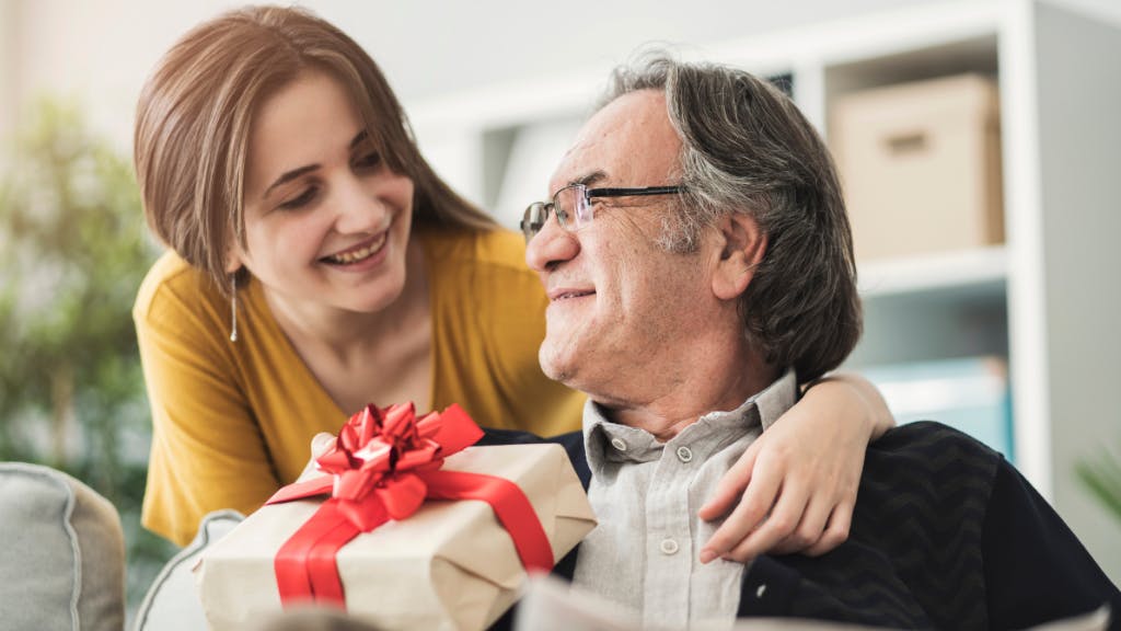 Daughter giving dad Father's Day gift