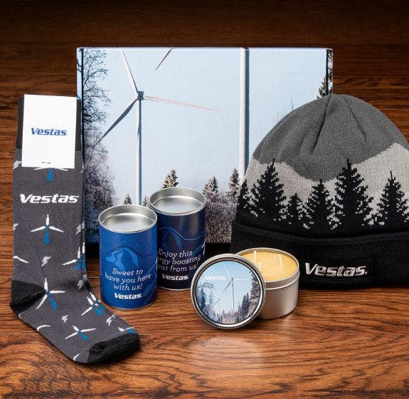 Custom kit that 1338Tryon made for Vestas including Sock Club custom dress socks, a knit beanie, a candle, and cookies in a branded box