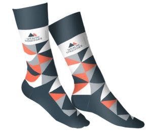 Custom socks with the Wealth Strategies logo and a navy, orange, grey, and white argyle pattern