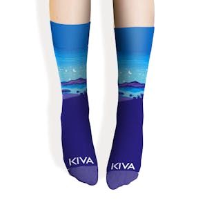 Person wearing Kiva Confections custom branded blue landscape socks