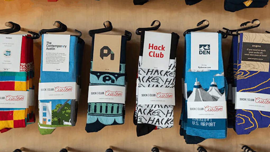sock club custom socks hanging on wall