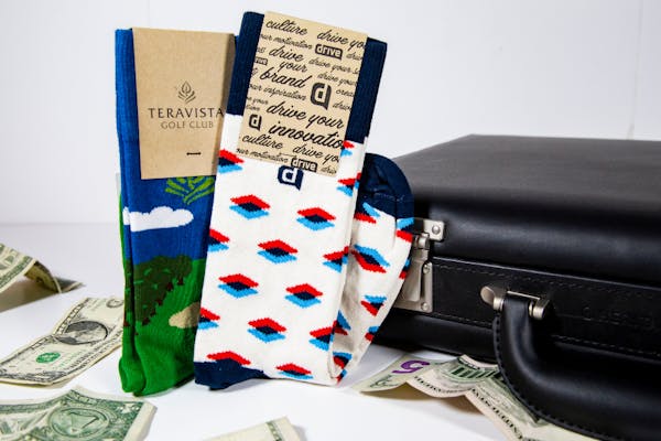 custom socks around money and briefcase