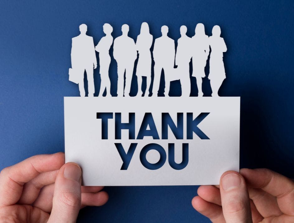 Company appreciation gift thank you card with cut out letters on a blue background