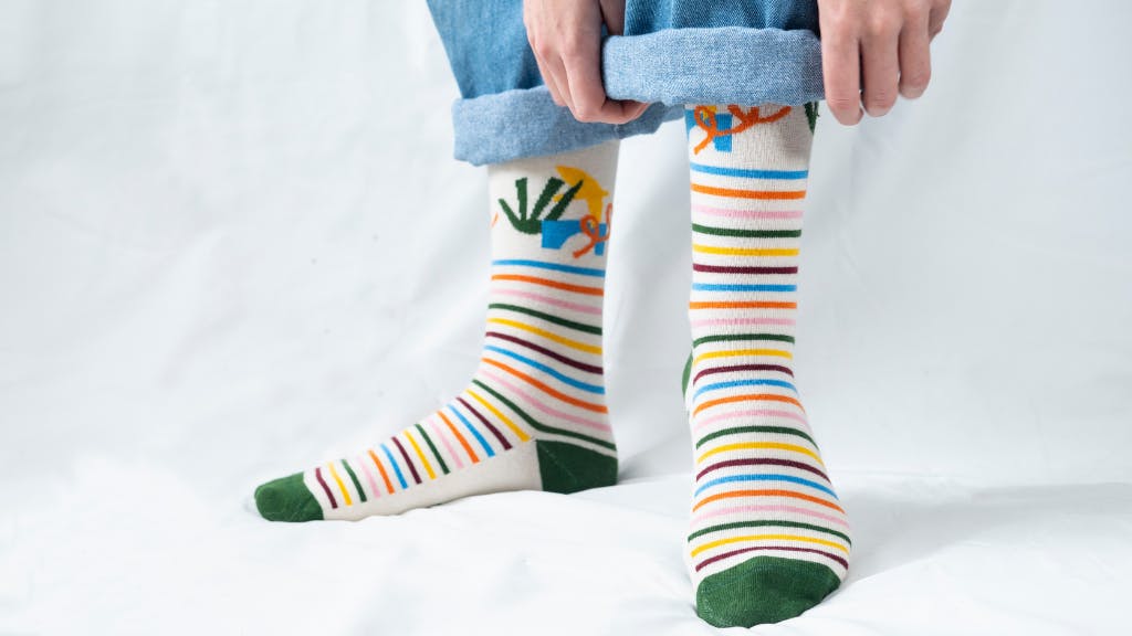 custom dress socks with stripes with someone rolling up pants
