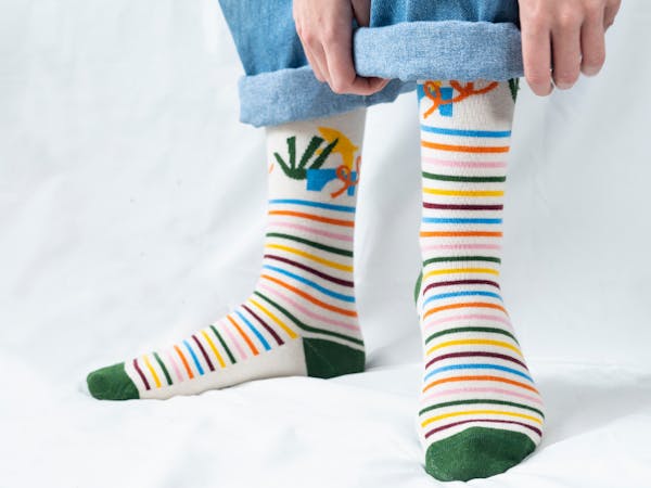 custom dress socks with stripes with someone rolling up pants