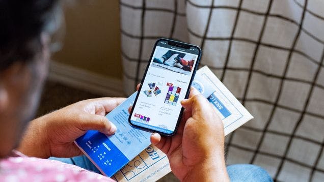 Company swag store customer visiting a swag store on his phone selecting a promotional product to receive