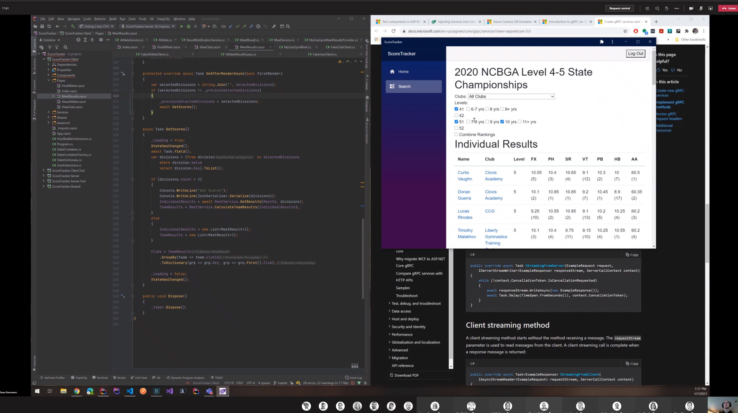 电脑屏幕显示代码和一个带有地区排名的体操得分跟踪应用程序