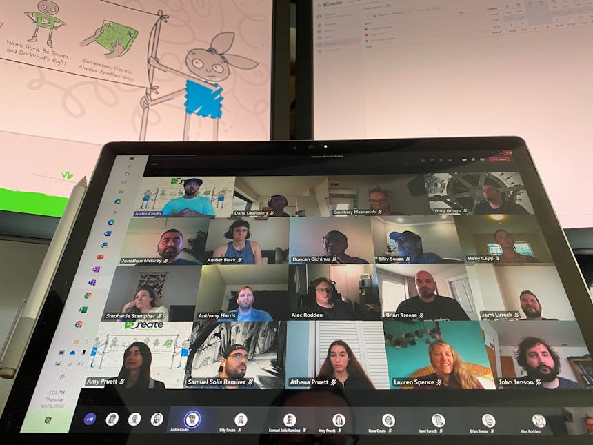 The SoCreate Team appears in a grid on a laptop screen for a virtual meeting