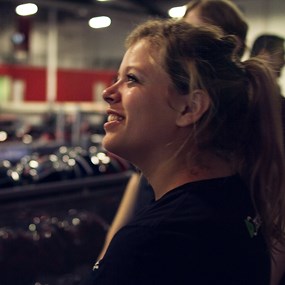 Alli smiling as she looks on
