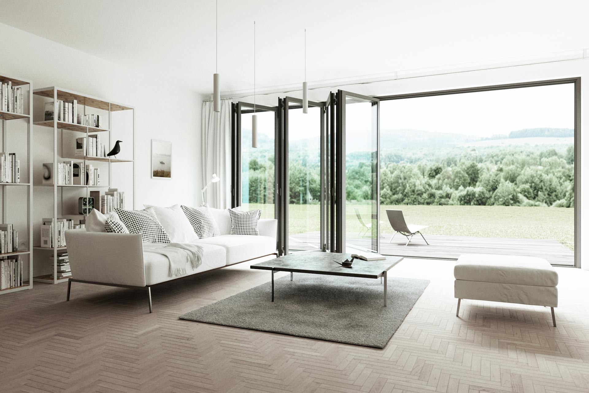 white sofa in beige living room with bifold doors and country views