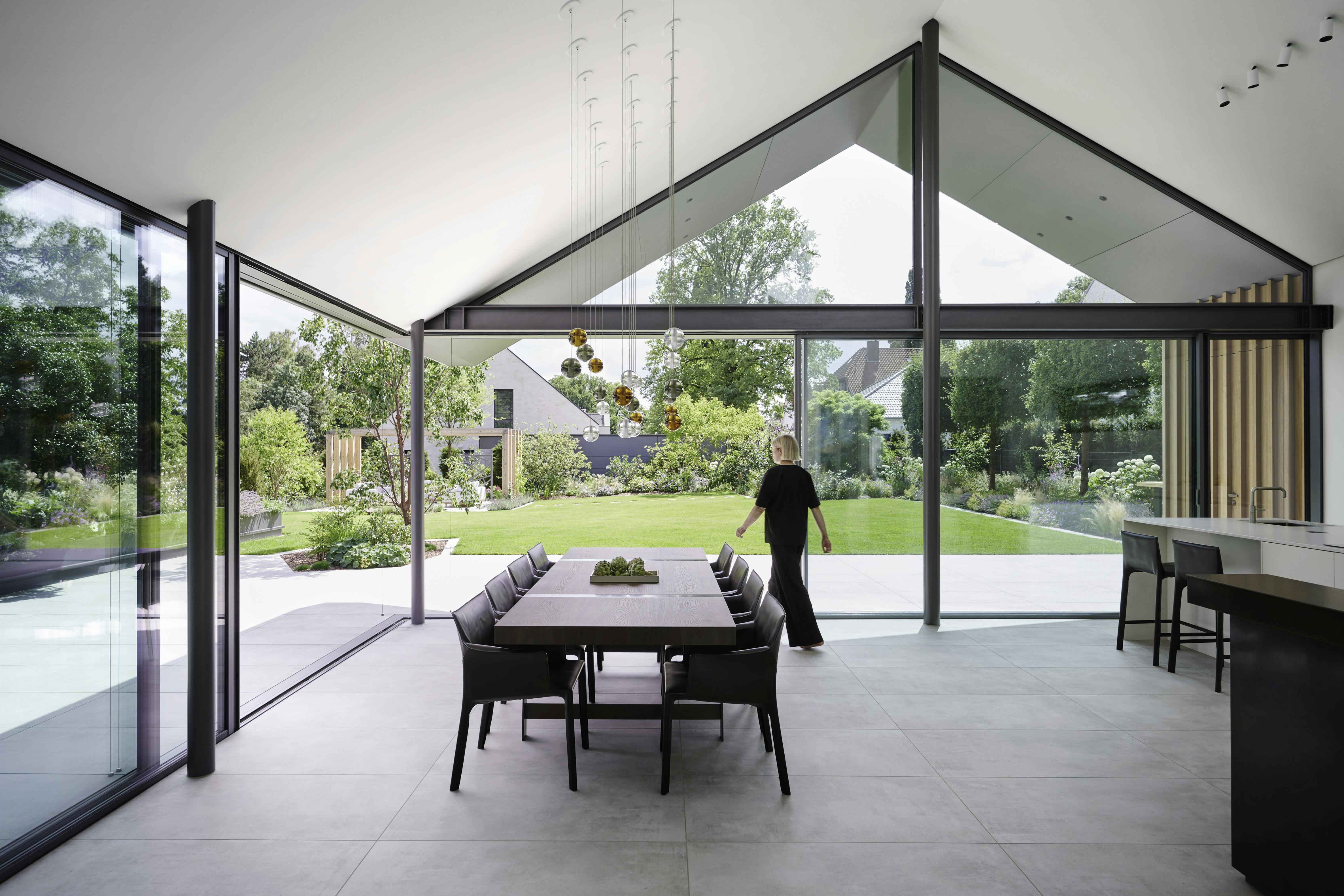 living room with large sliding doors, open corner and triangular window above