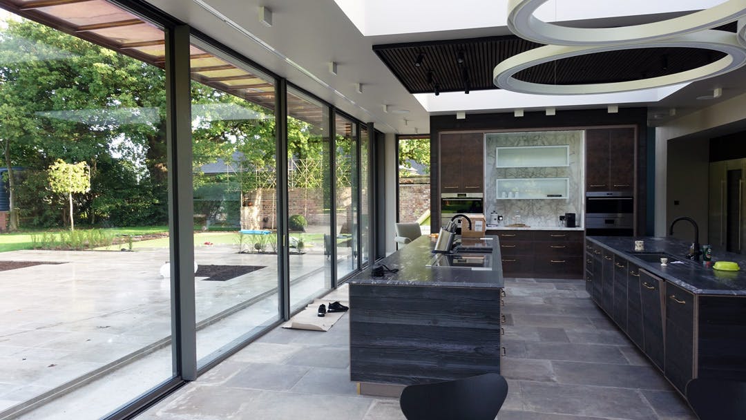 Luxury kitchen with large sliding glass doors