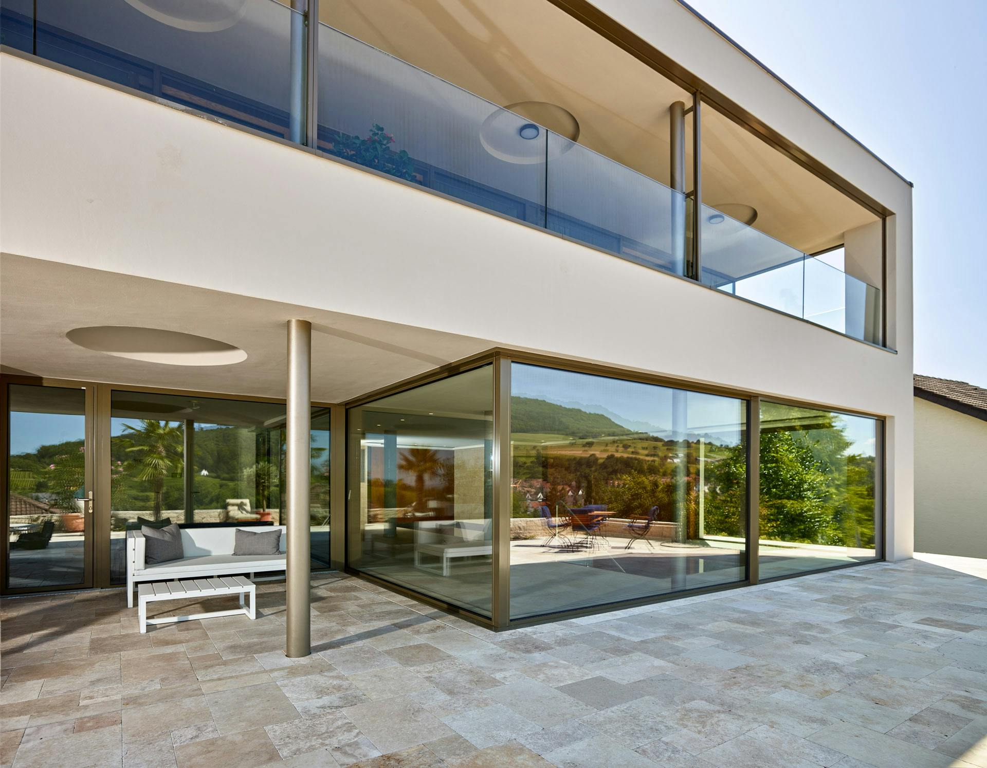 sliding doors and open corner in contemporary property with patio