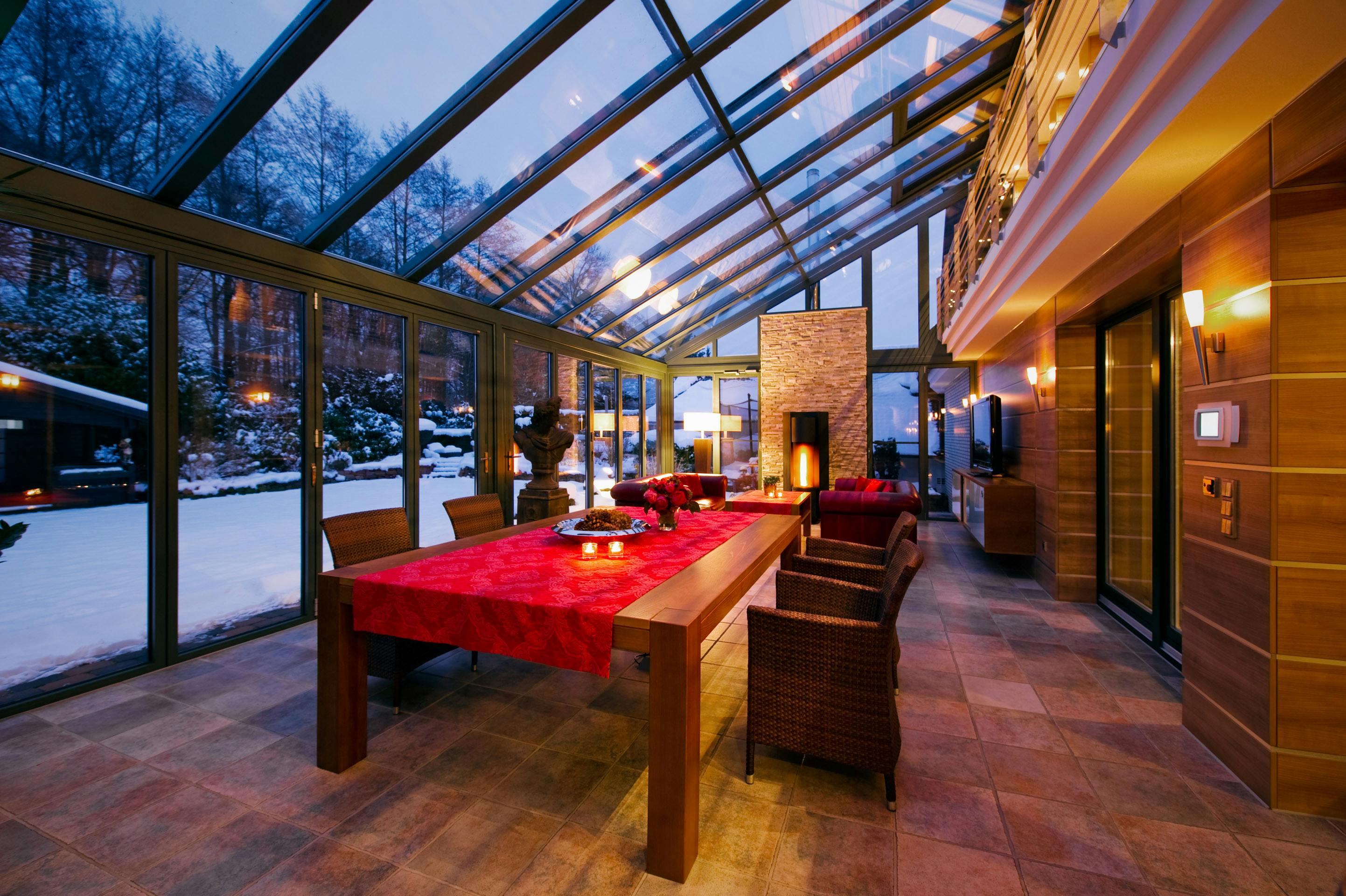 Warm and inviting dining room with view to snowy garden outside