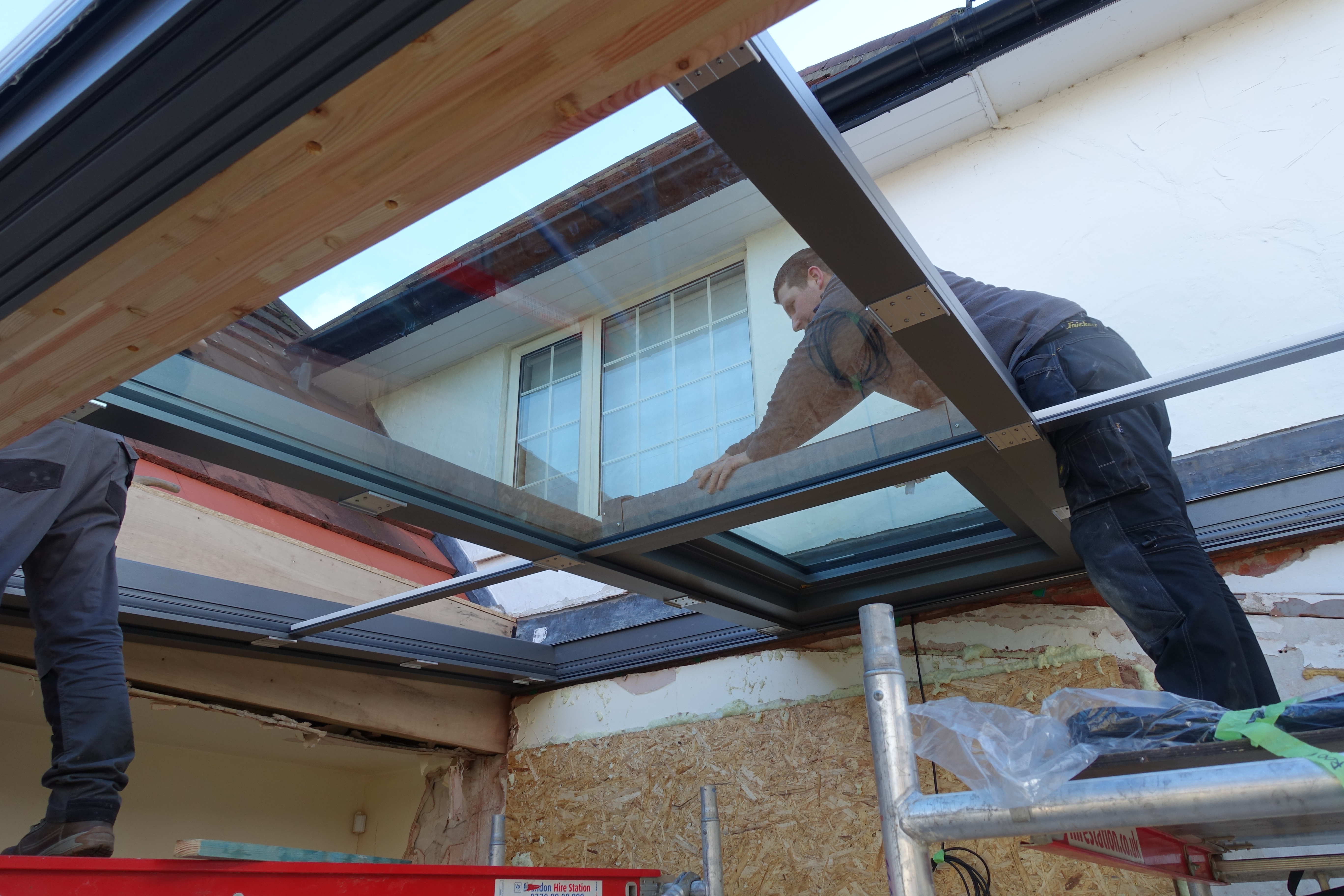 our team installing a glass extension as a Solarlux partner