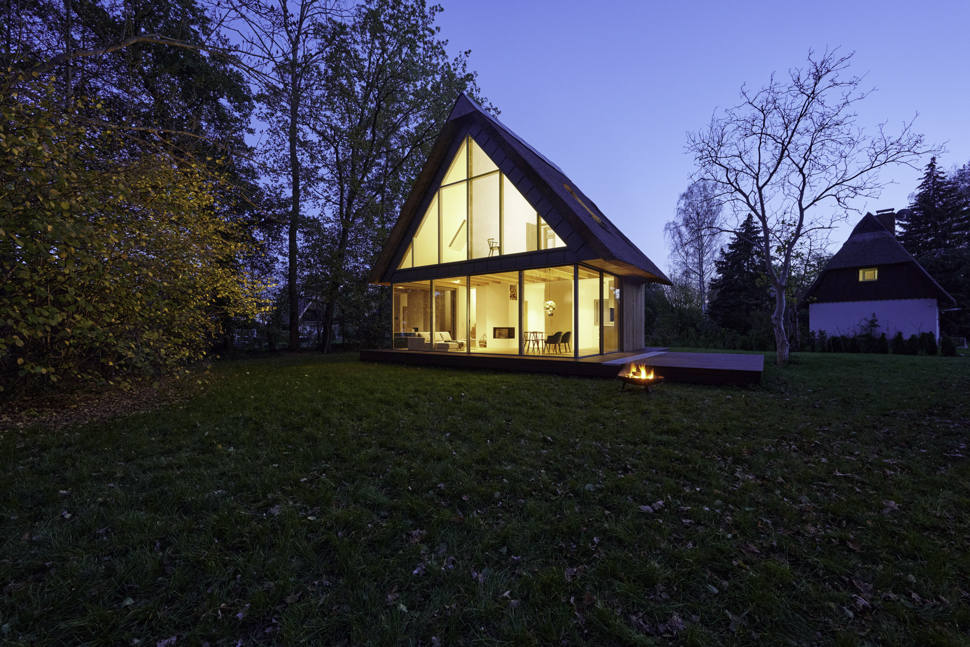 Dusk image of closed sliding doors with soft lighting