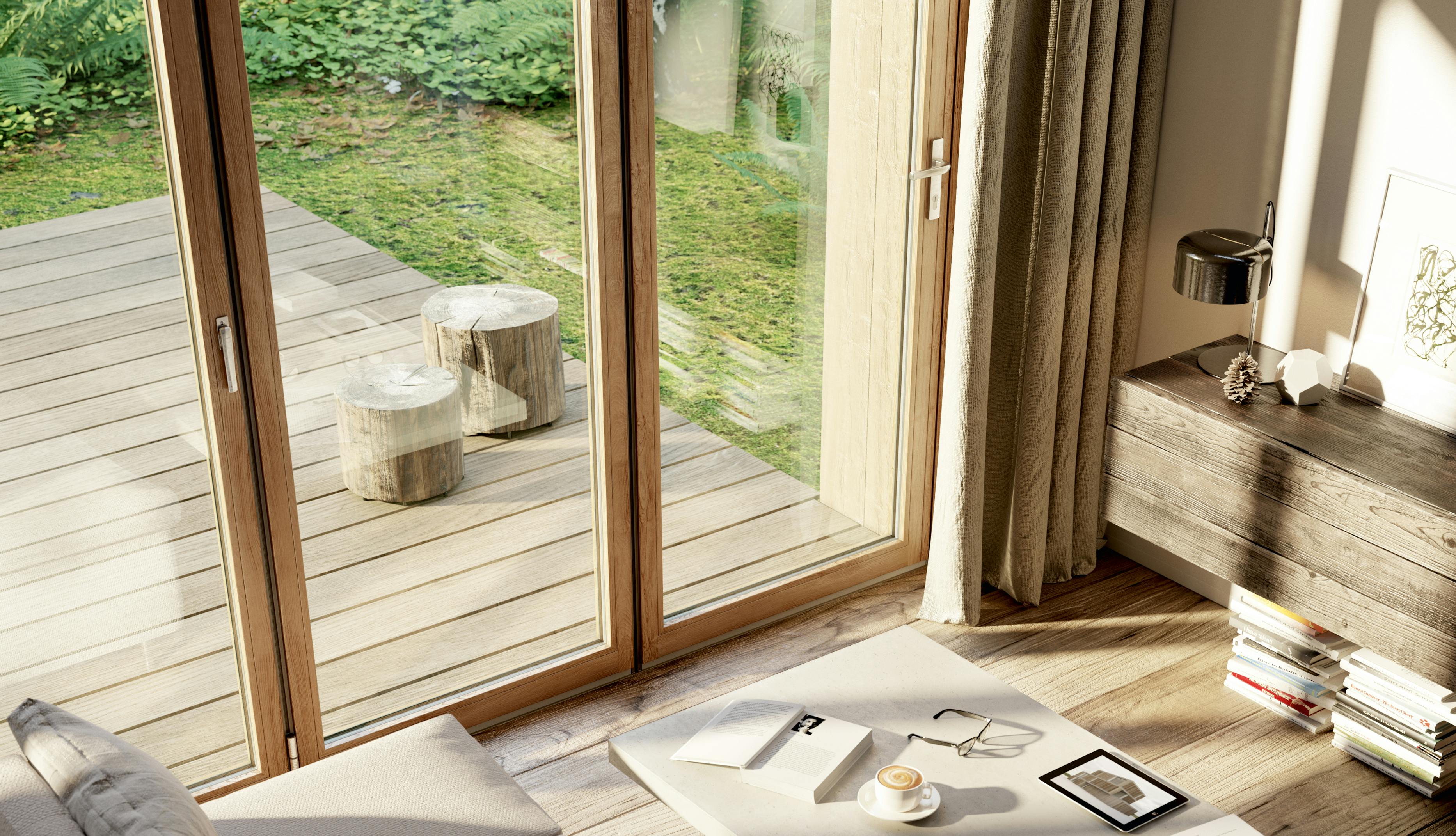 Sunlight streaming into a room with wooden floors, doors and sideboard