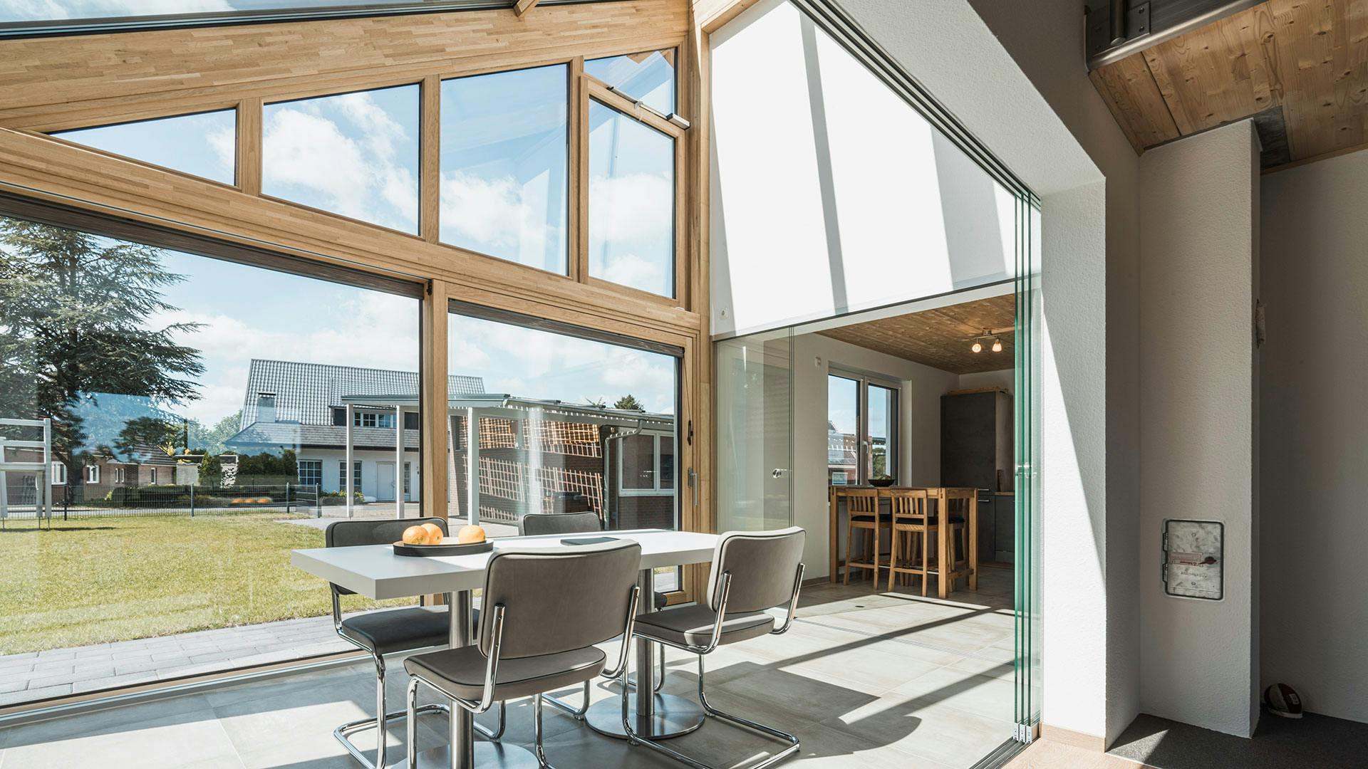Large wooden glazing system in a German home using the Solarlux SL178 sliding door