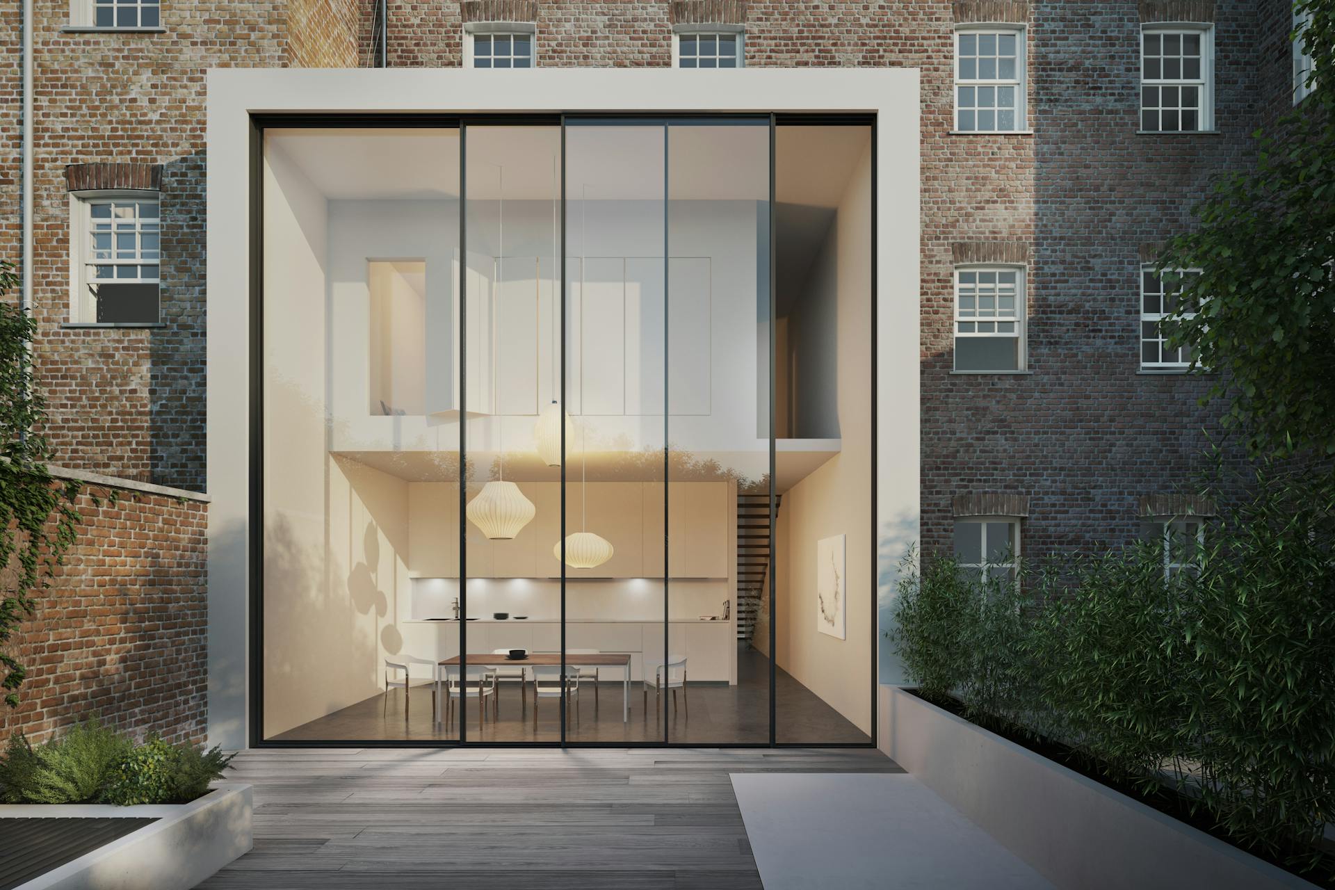 Huge sliding glass doors on modern extension contrast with Victorian terraced property