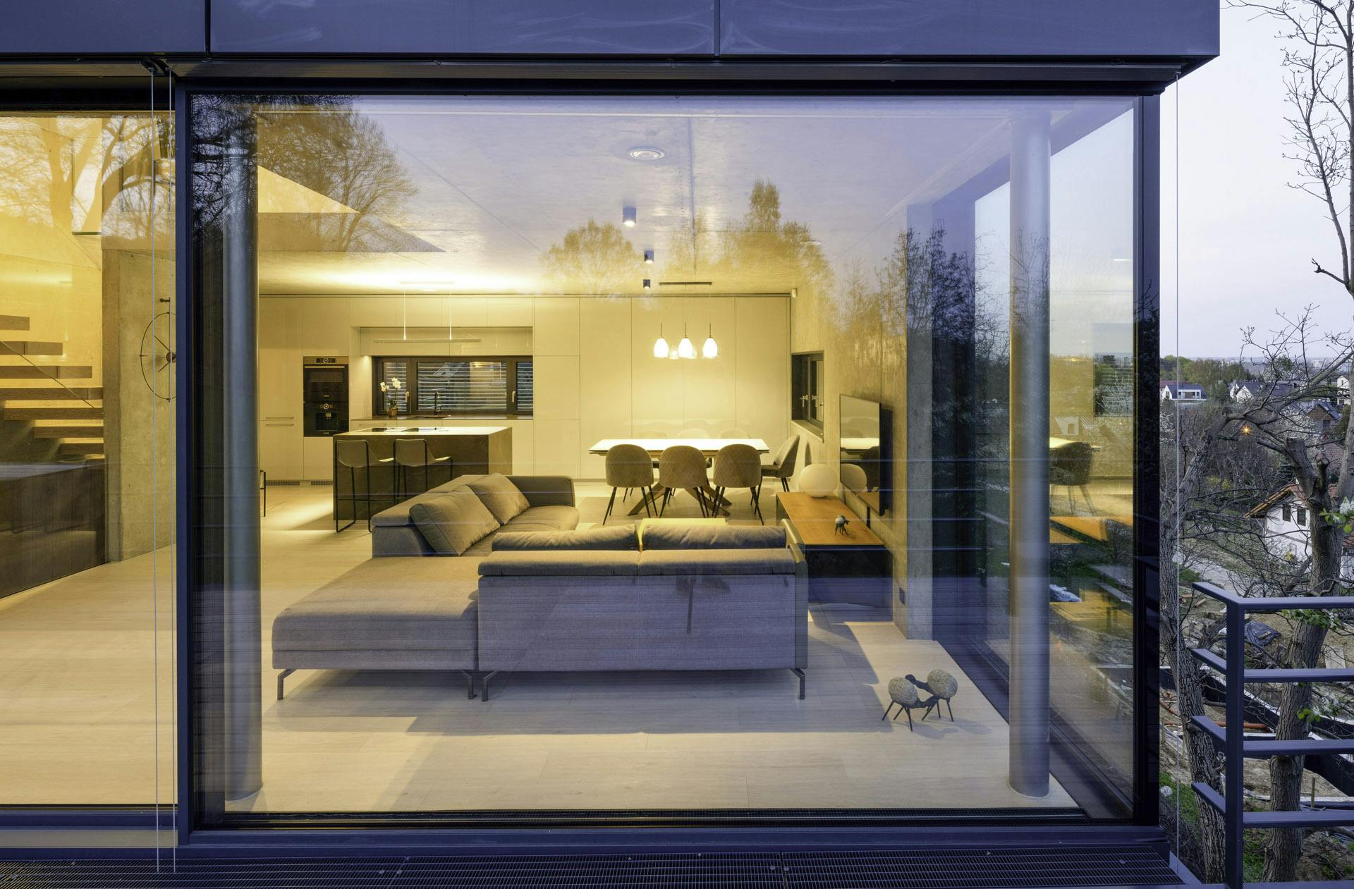 Steel pole inside room supports open corner glass doors